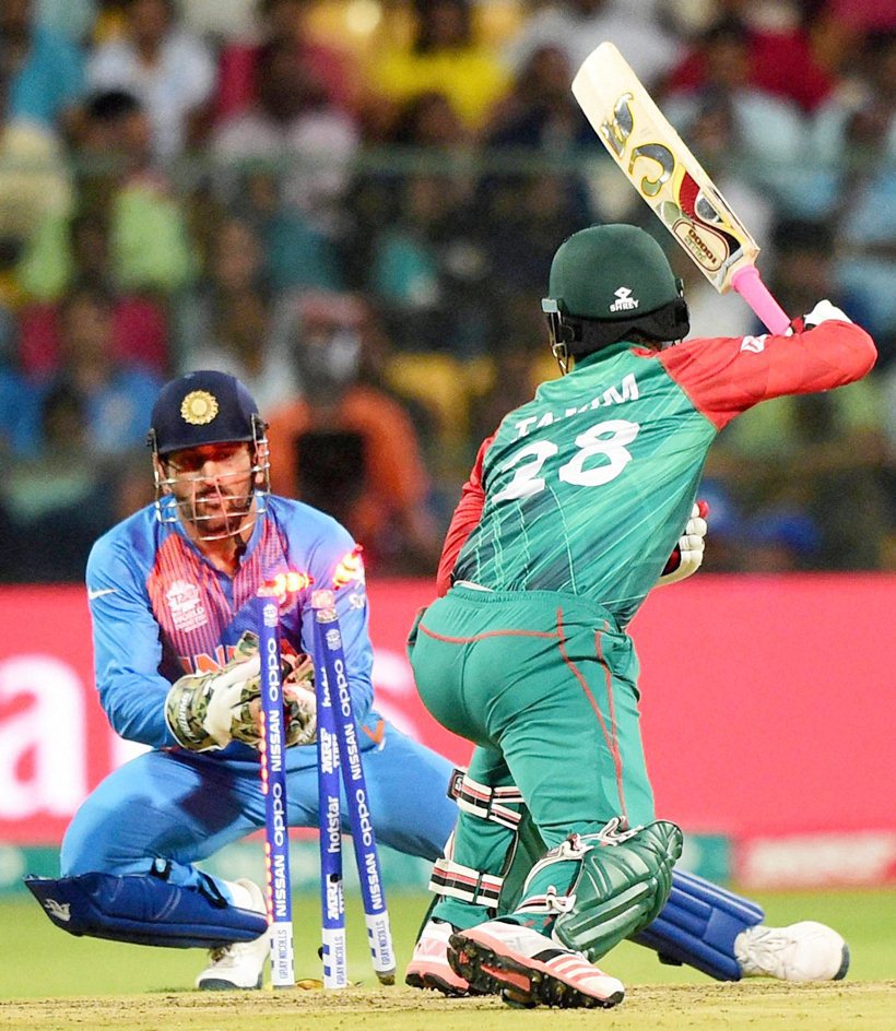 Bengaluru : Bangladesh Tamim Iqbal stumped by M S Dhoni during the ICC World T20 match between India and Bangladesh at Chinnaswamy Stadium in Bengaluru on Wednesday. PTI Photo by Shailendra Bhojak(PTI3_23_2016_000300B)