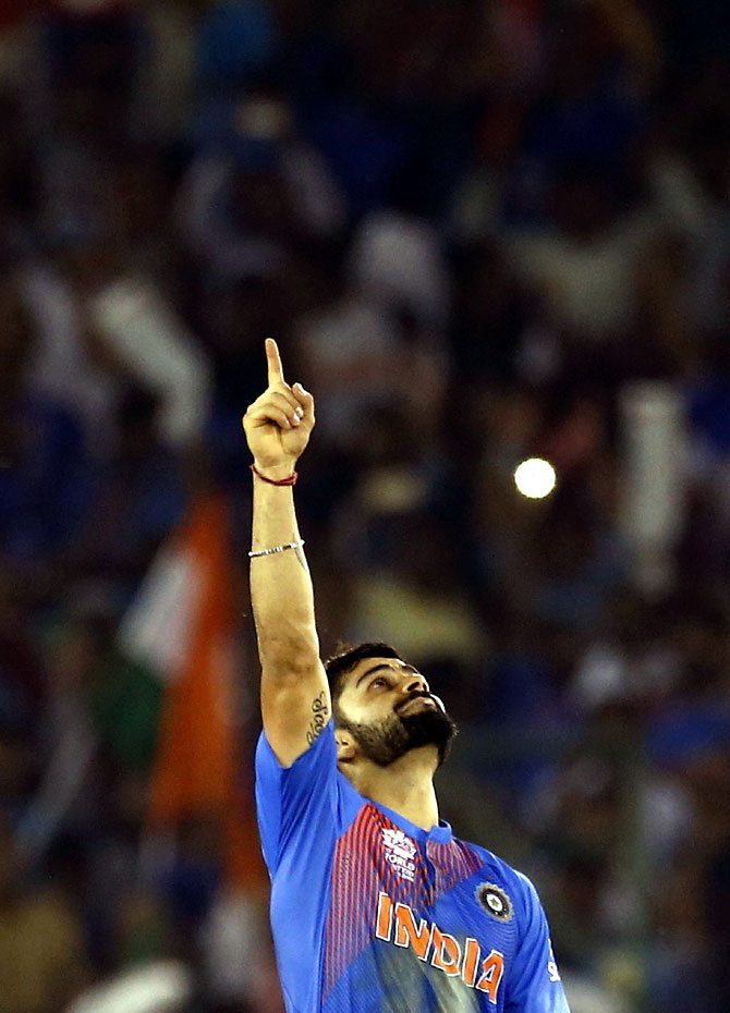 India's Virat Kohli celebrates after winning their match. (REUTERS)