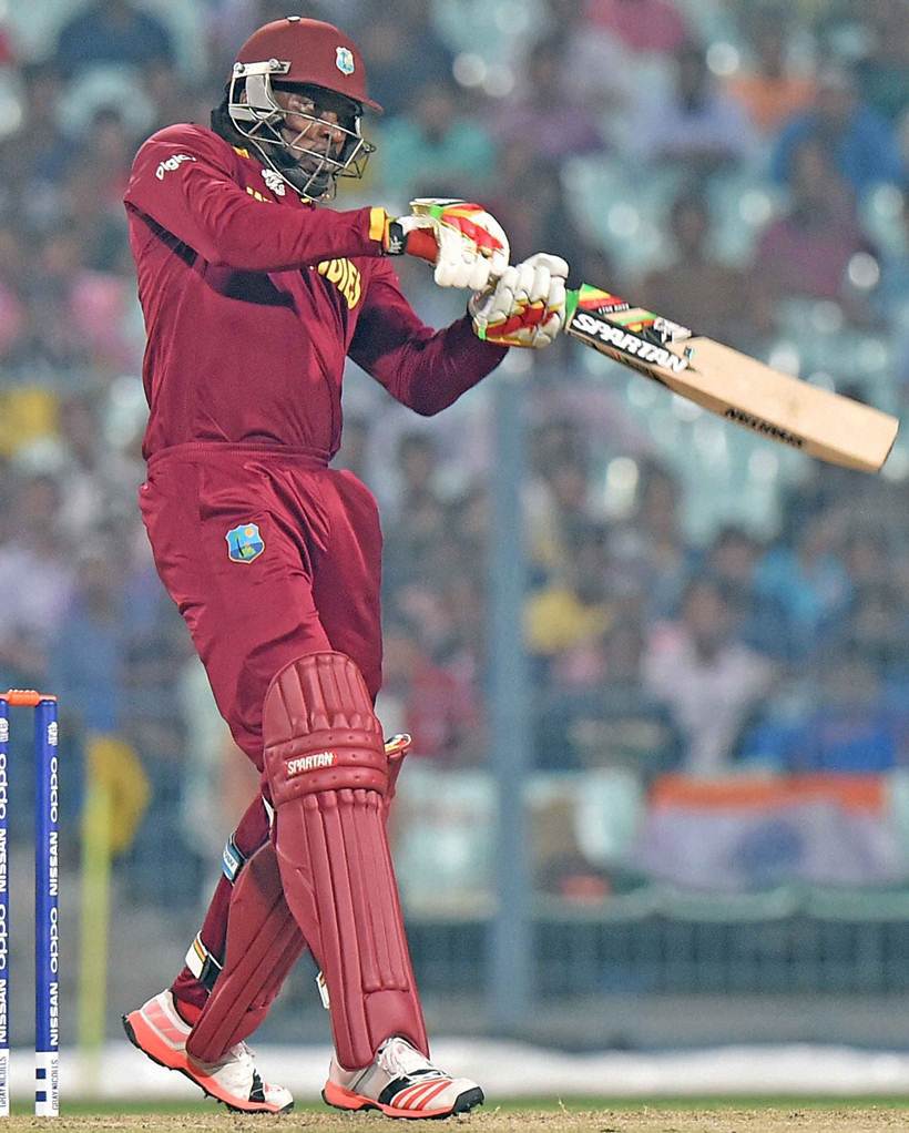 Kolkata: West Indies batsman Chris Gayle plays a shot during a warm-up match against India at Eden Garden in Kolkata on Thursday. PTI Photo by Ashok Bhaumik (PTI3_10_2016_000340A)