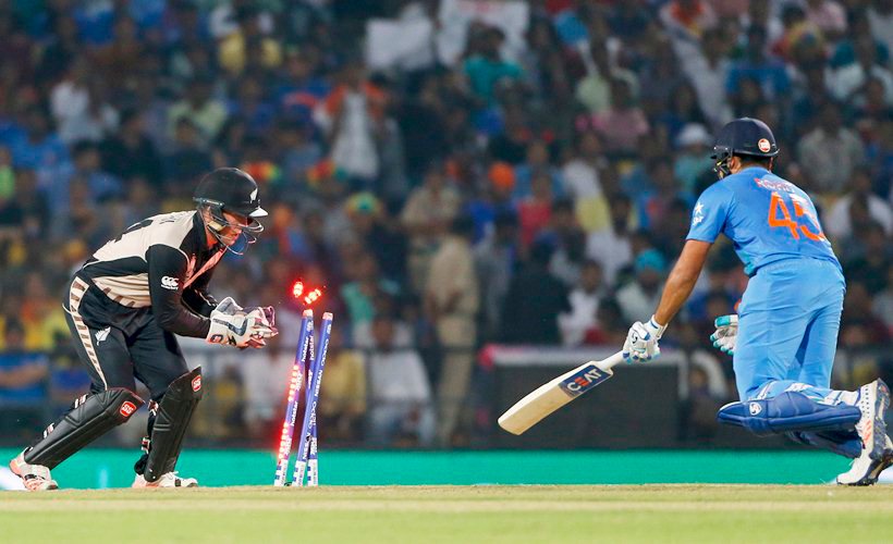India's Rohit Sharma is stumped by New Zealand's Luke Ronchi during the ICC World Twenty20 2016 cricket match at the Vidarbha Cricket Association stadium in Nagpur, India, Tuesday, March 15, 2016. (AP Photo/Saurabh Das)