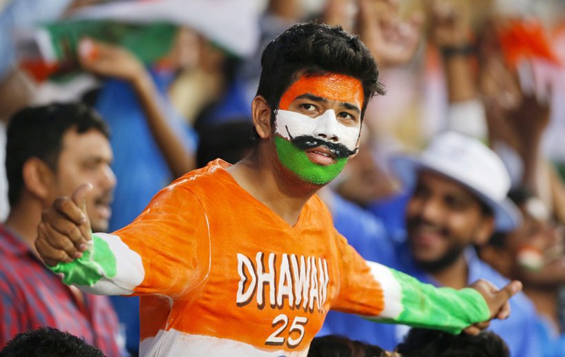 An Indian fan cheers for the Indian cricket team before India's Twenty20 World Cup match against New Zealand at the Vidarbha Cricket Association stadium in Nagpur, India, Tuesday, March 15, 2016. (AP Photo/Saurabh Das)