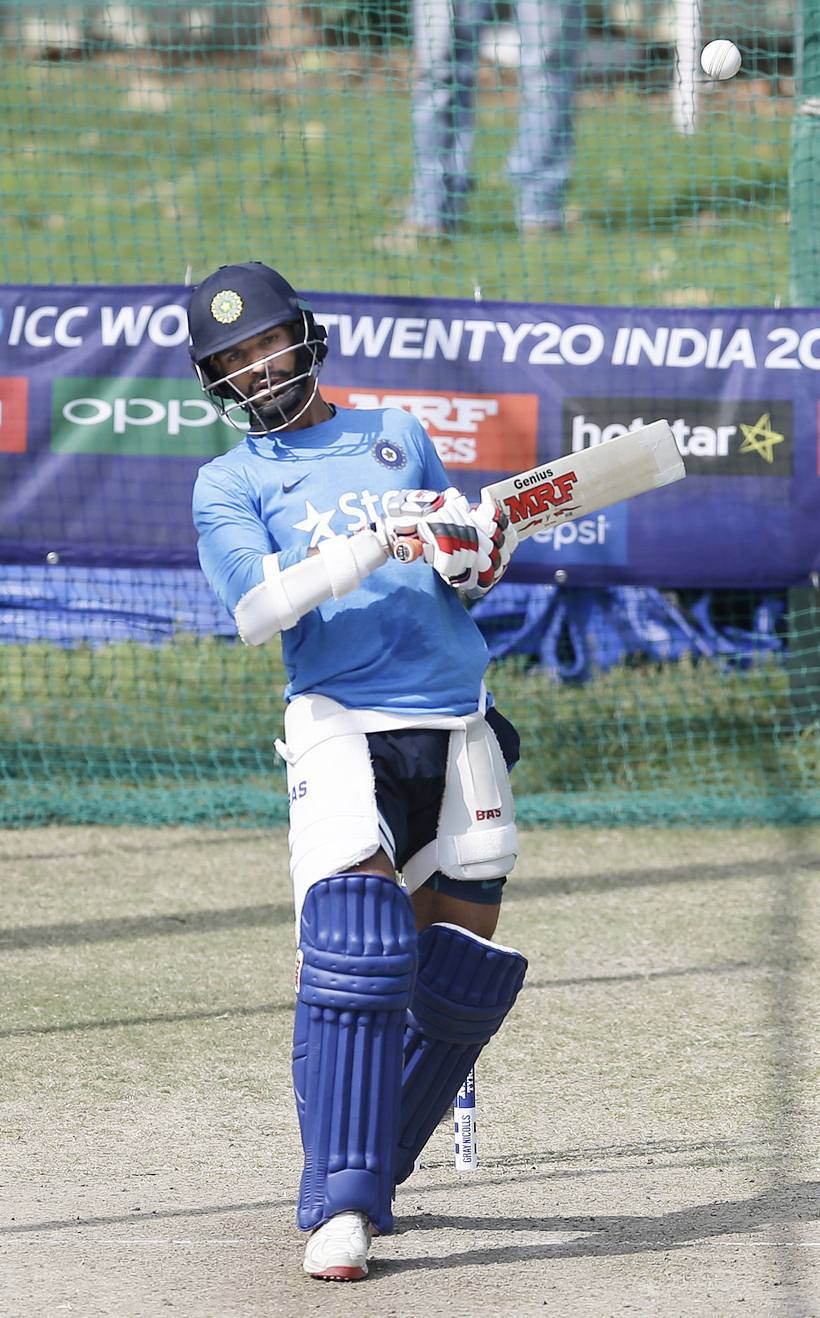 India's Shikhar Dhawan bats in the nets during a practice session ahead of their ICC World Twenty20 2016 cricket match against Australia in Mohali, India, Saturday, March 26, 2016. (AP Photo/Altaf Qadri)