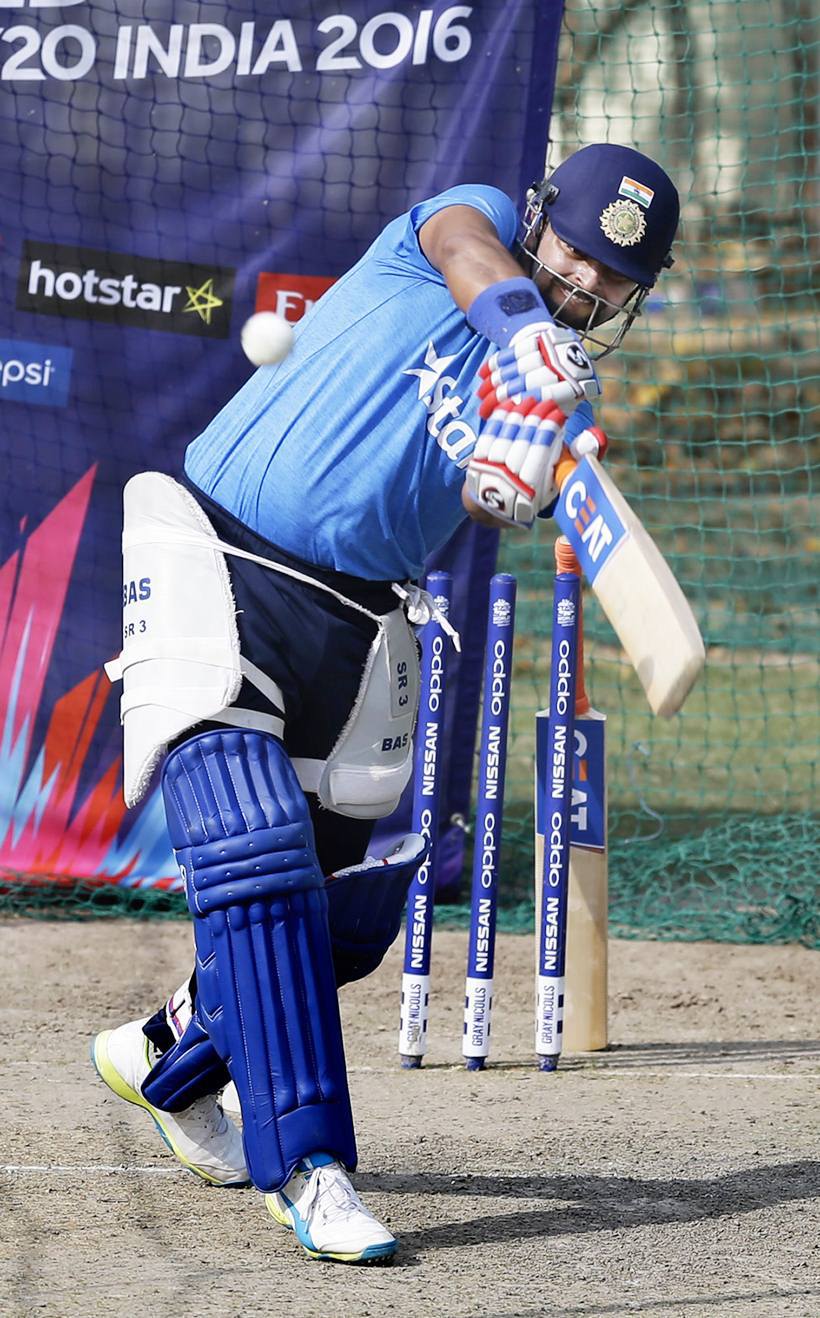 India's Suresh Raina bats in the nets during a practice session ahead of their ICC World Twenty20 2016 cricket match against Australia in Mohali, India, Saturday, March 26, 2016. (AP Photo/Altaf Qadri)