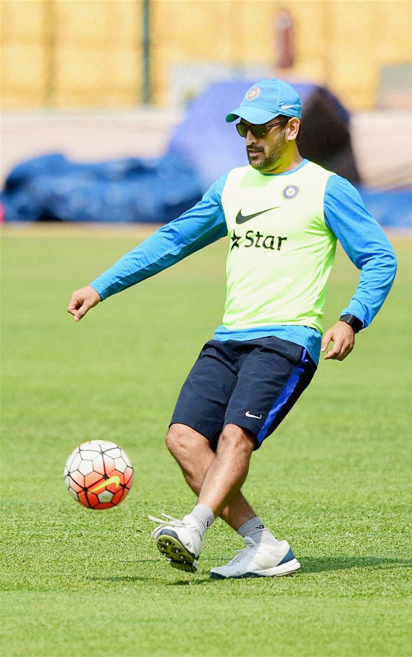 Bengaluru: India's skipper M S Dhoni plays a game of soccer during a training session at Chinnaswamy Stadium in Bengaluru on Tuesday. PTI Photo by Shailendra Bhojak (PTI3_22_2016_000216B) *** Local Caption ***