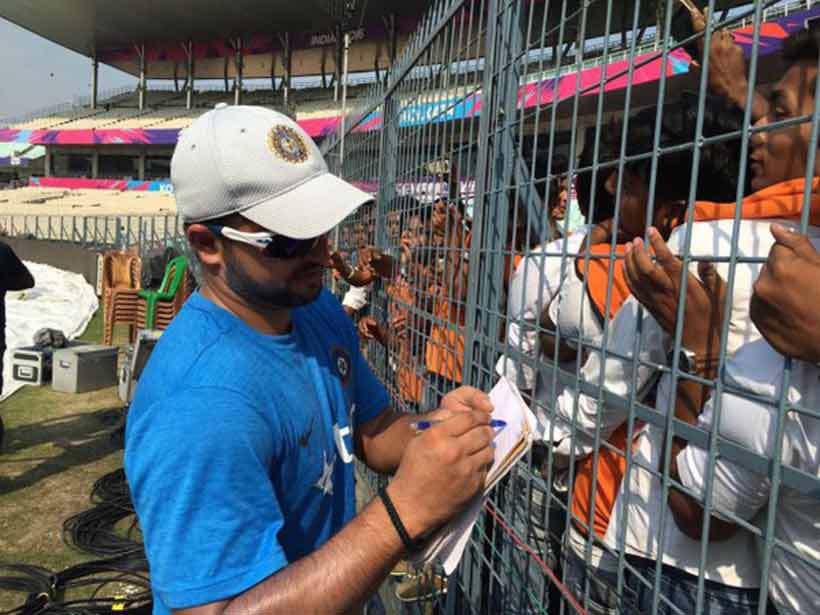 Suresh Raina obliges fans after the session - signing some autographs for the people who turned out to see the team practice. (Source: Twitter)