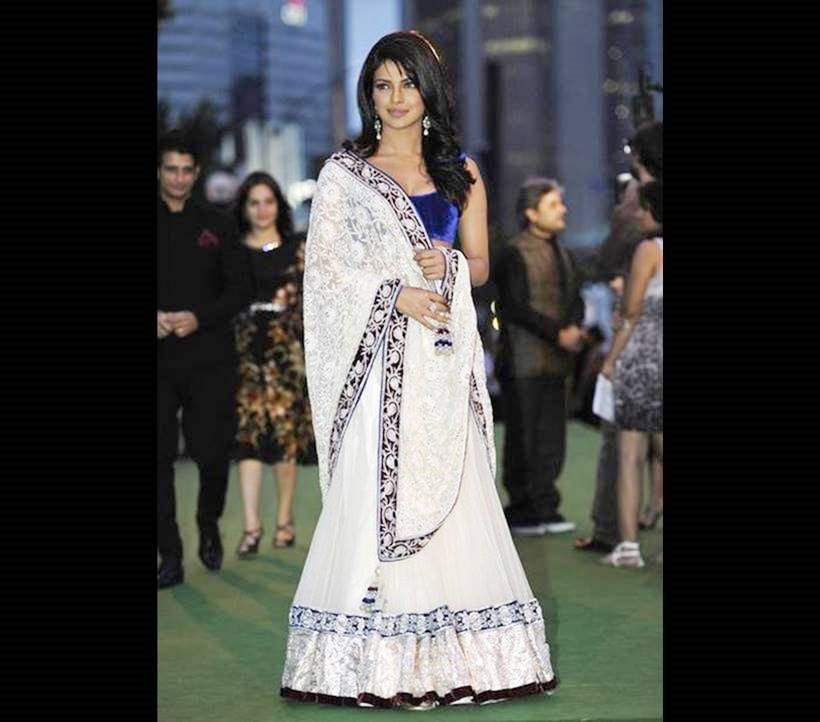 Opting for a desi look with this white and blue Manish Malhotra creation, Chopra was a vision of elegance and Indian beauty at the 2011 International Indian Film Academy awards in Toronto. This bears witness to the star's propensity to opt for an Indian look for the IIFA awards each time. (Source: AP)