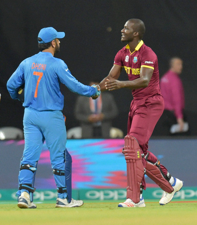Mumbai: Indias captain greets West Indies captain D Sammy after the winning ICC WT20 semi final match against West Indies at Wankhede Stadium in Mumbai on Thursday. PTI Photo by Santosh Hirlekar(PTI3_31_2016_000348B)