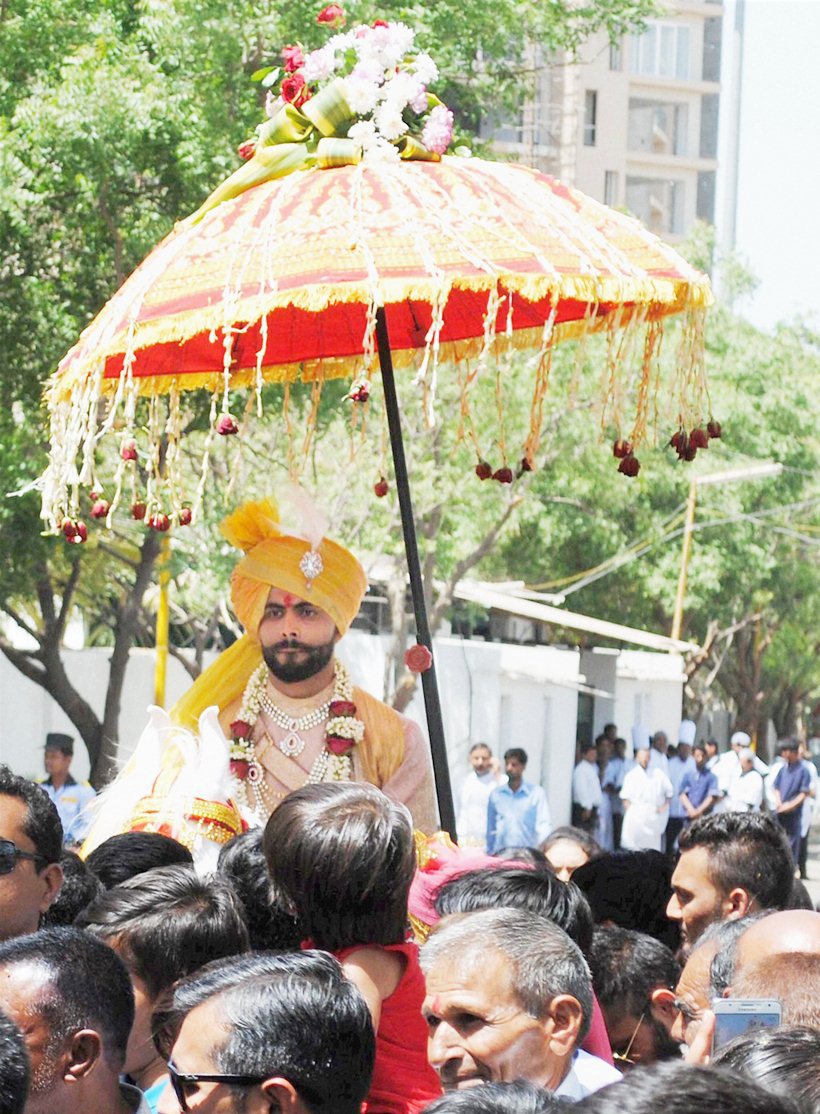 Rajkot: Cricket Ravindra Jadeja during the 'Baarast'procession of his wedding in Rajkot on Saturday. PTI Photo(PTI4_17_2016_000173B)