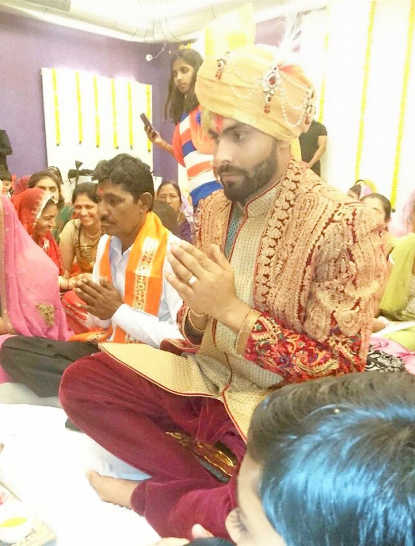 Rajkot: Cricketer Ravindra Jadeja performing a ritual before his wedding in Rajkot on Saturday. PTI Photo(PTI4_17_2016_000109B)