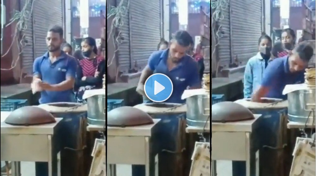 man preparing Tandoori roti with spitting