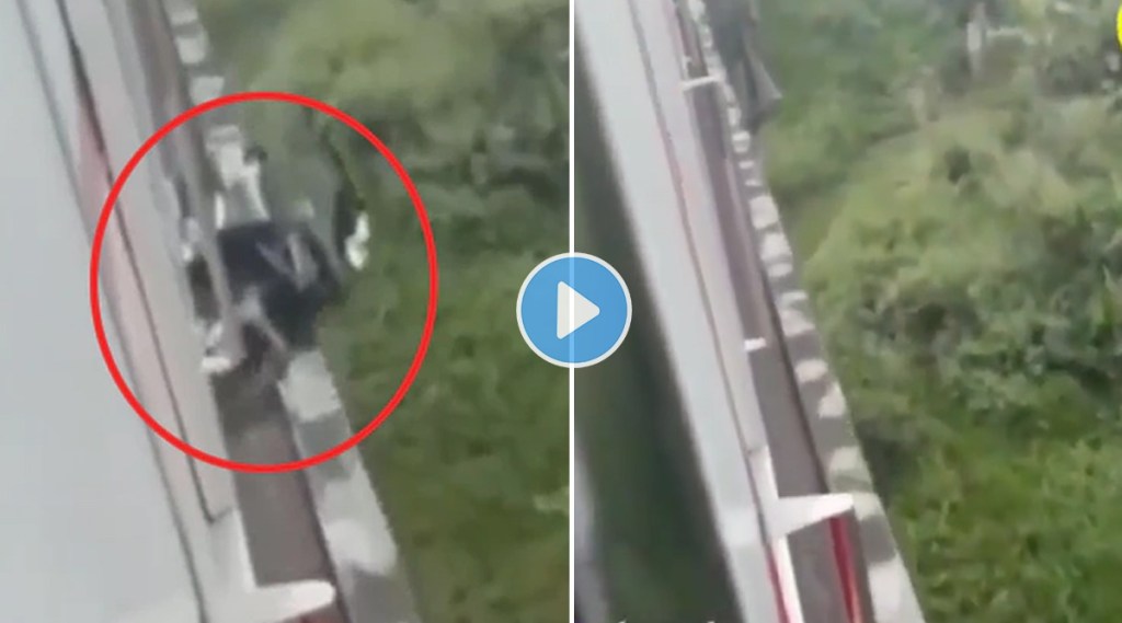 man riding bike on railway tracks