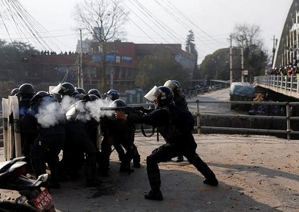 Police clash with protesters in Nepal over US grant