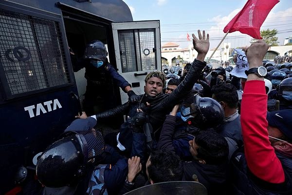 Police clash with protesters in Nepal over US grant