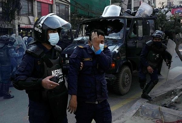 Police clash with protesters in Nepal over US grant