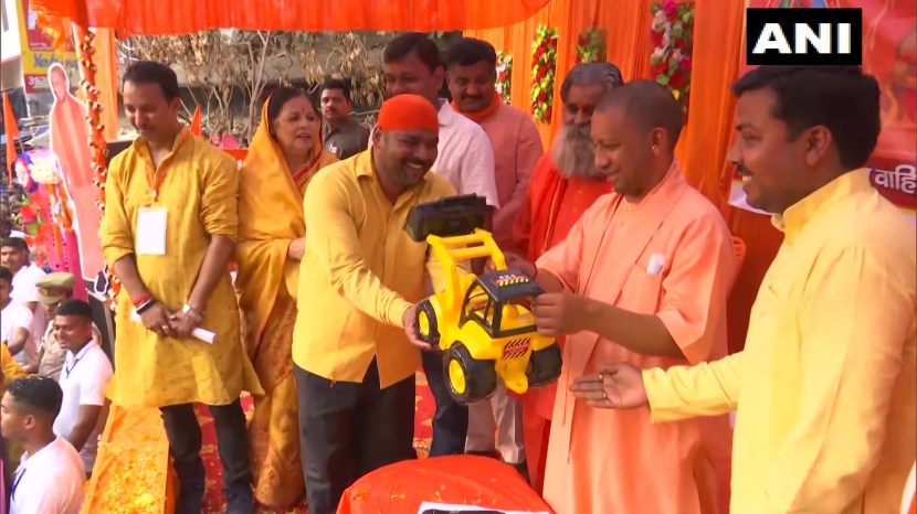 With sunglasses toy bulldozer Yogi Adityanath celebrates Holi in Gorakhpur See pics