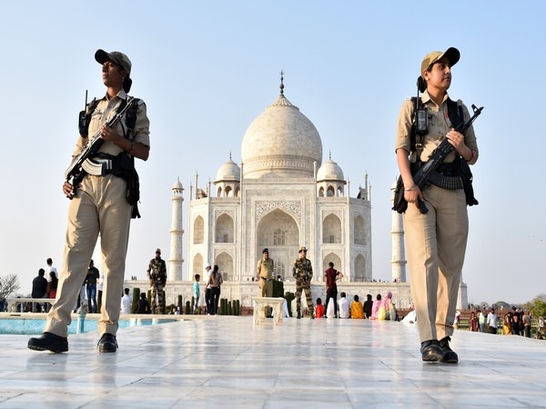 Agra, Mar 07 (ANI): Central Industrial Security Force (CISF) women personnel stand guard at the premises of Taj Mahal for the security of the tourists, in Agra on Monday. (ANI Photo)