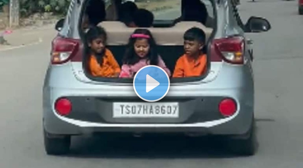 children in running car boot