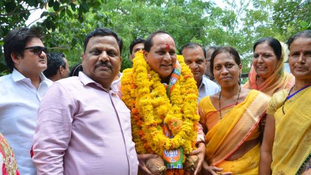 BJP MP Arjunlal Meena Celebrates karwa Chauth With Two Wives Who are Sisters Watch Unseen photos