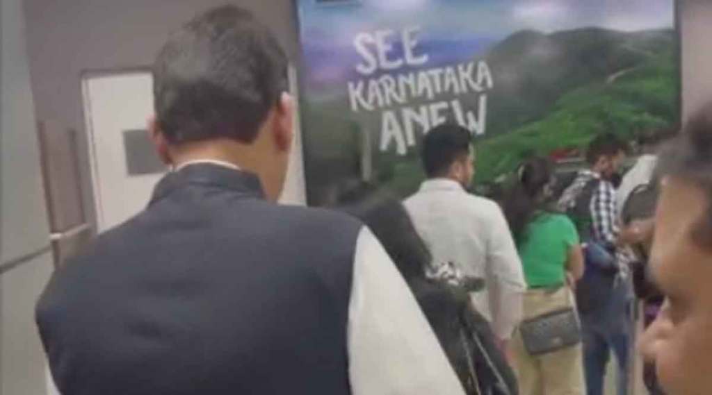 maharashtra deputy cm devendra fadnavis standing in queue at nagpur airport