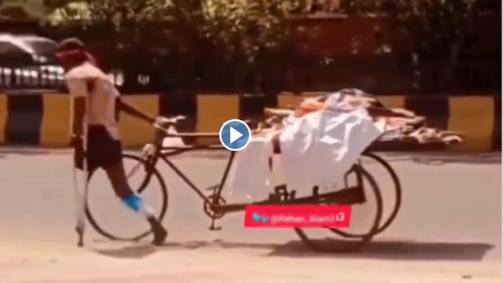 Specially abled man pulling a cart with one hand