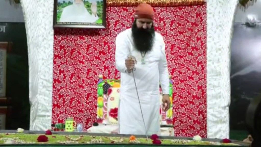 Ram Rahim cuts cake with sword