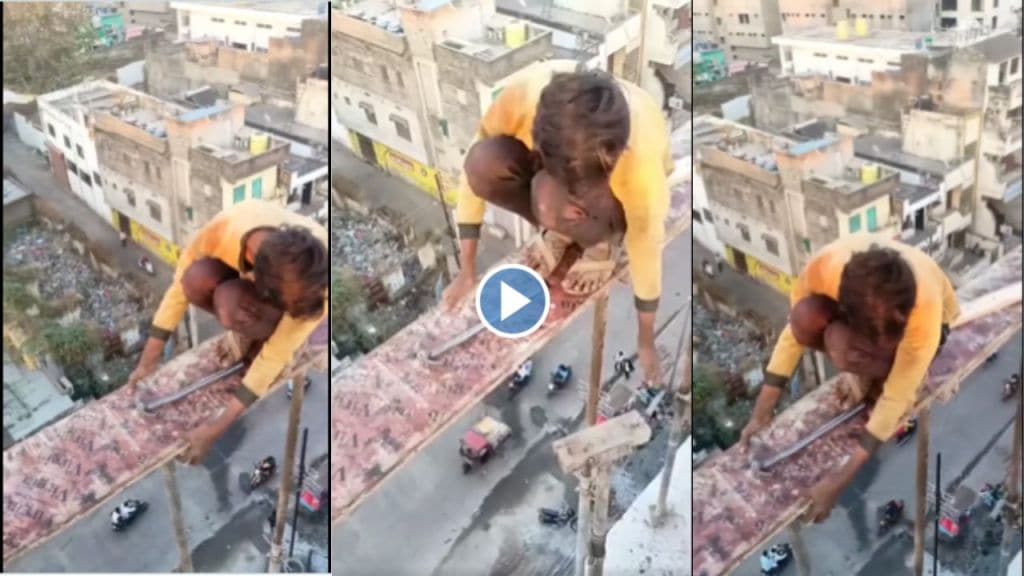 Boy sitting dangerously on edge of a under construction building