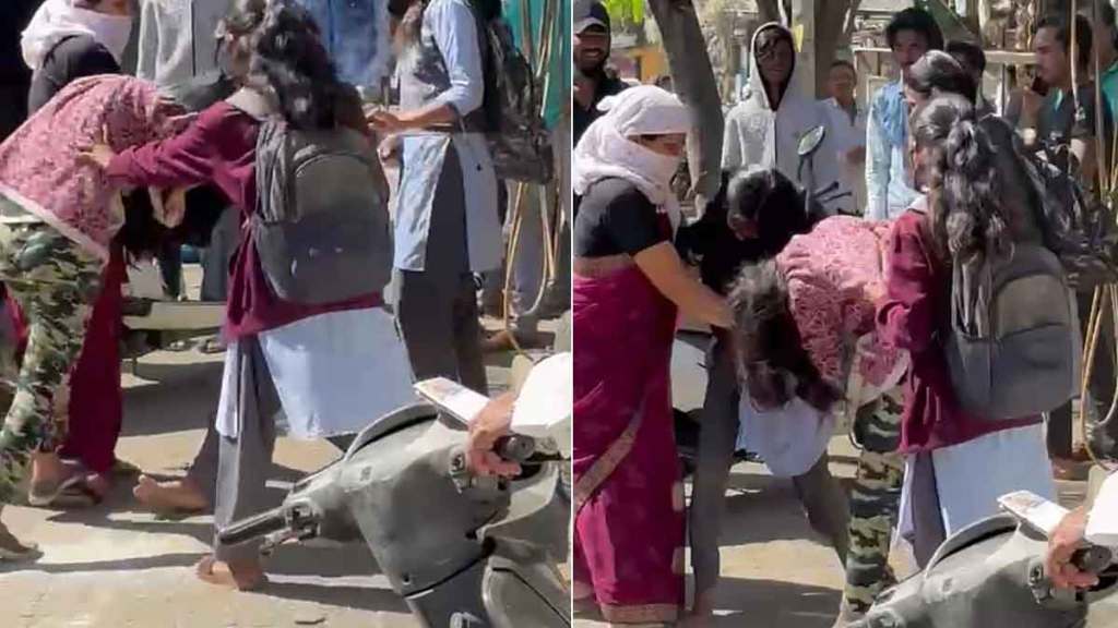 two school girl fighting on road