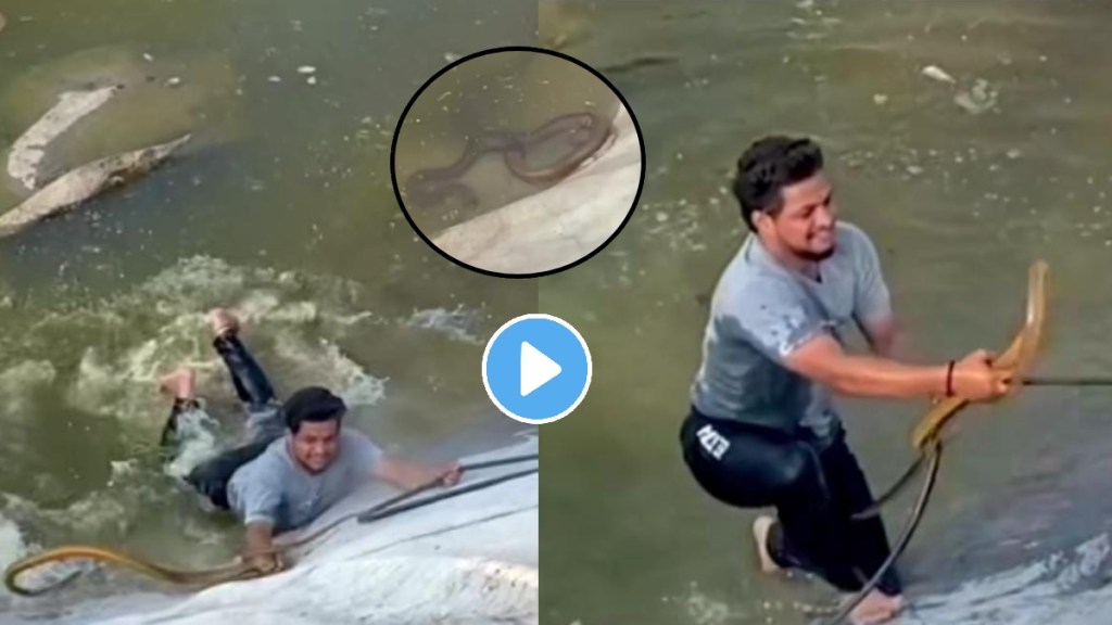 young man saves snake life