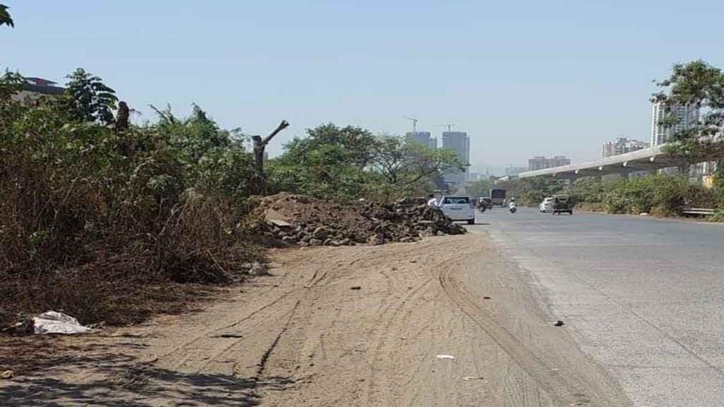 debris remains along with the road in thane