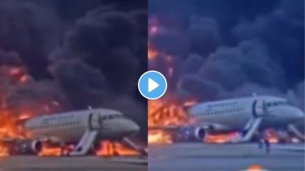 people running away from burning plane