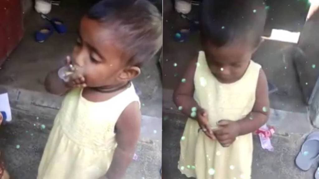 baby girl is seen smoking beedi