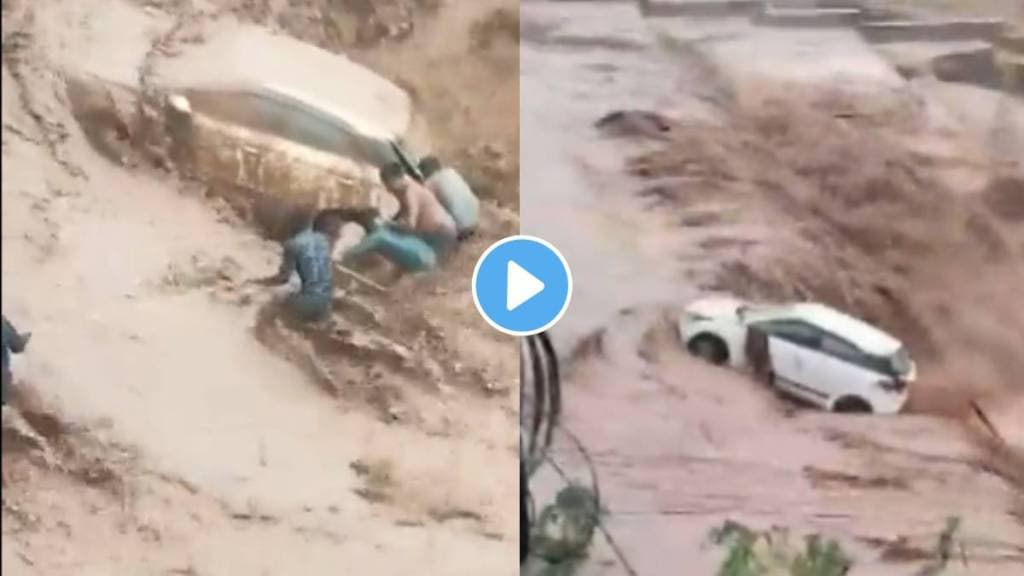 Women being rescued from car swept in water from the people in Panchkula, Haryana.Due to heavy rains cause flooding