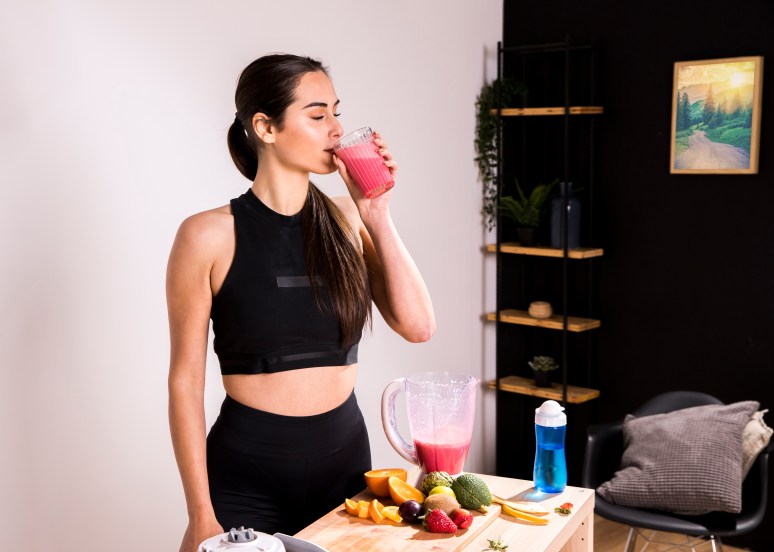 fitness-woman-drinking-detox-juice