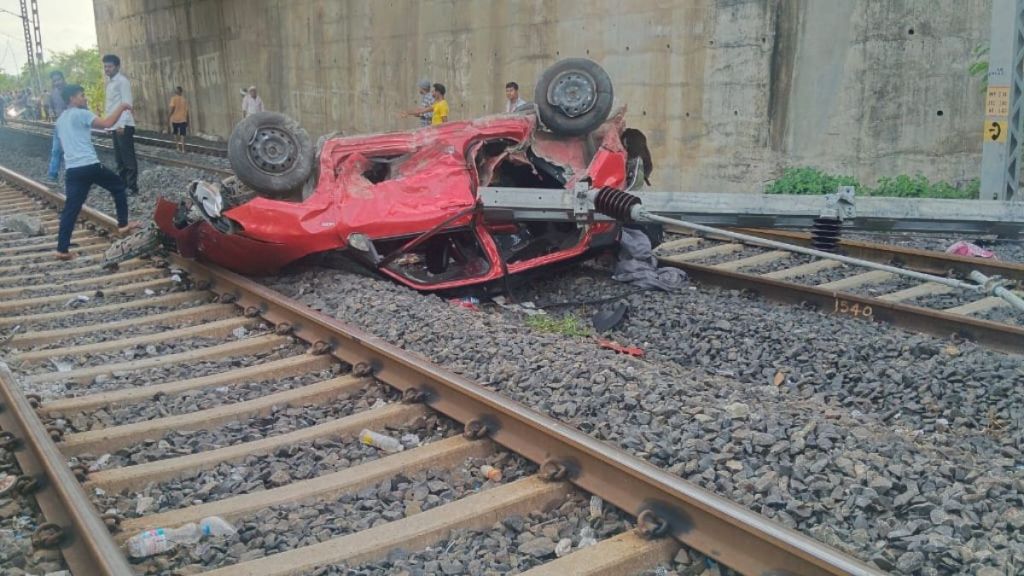 Car falls on railway track