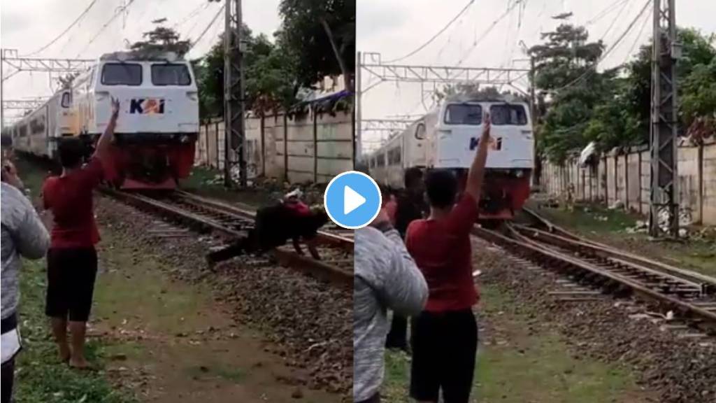 man was trying to stop the train lay down on rail track shocking video viral on internet