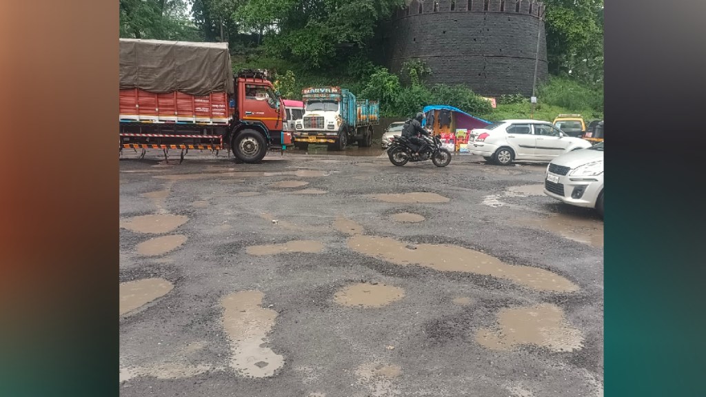 Potholes on the road near Durgadi Fort in Kalyan