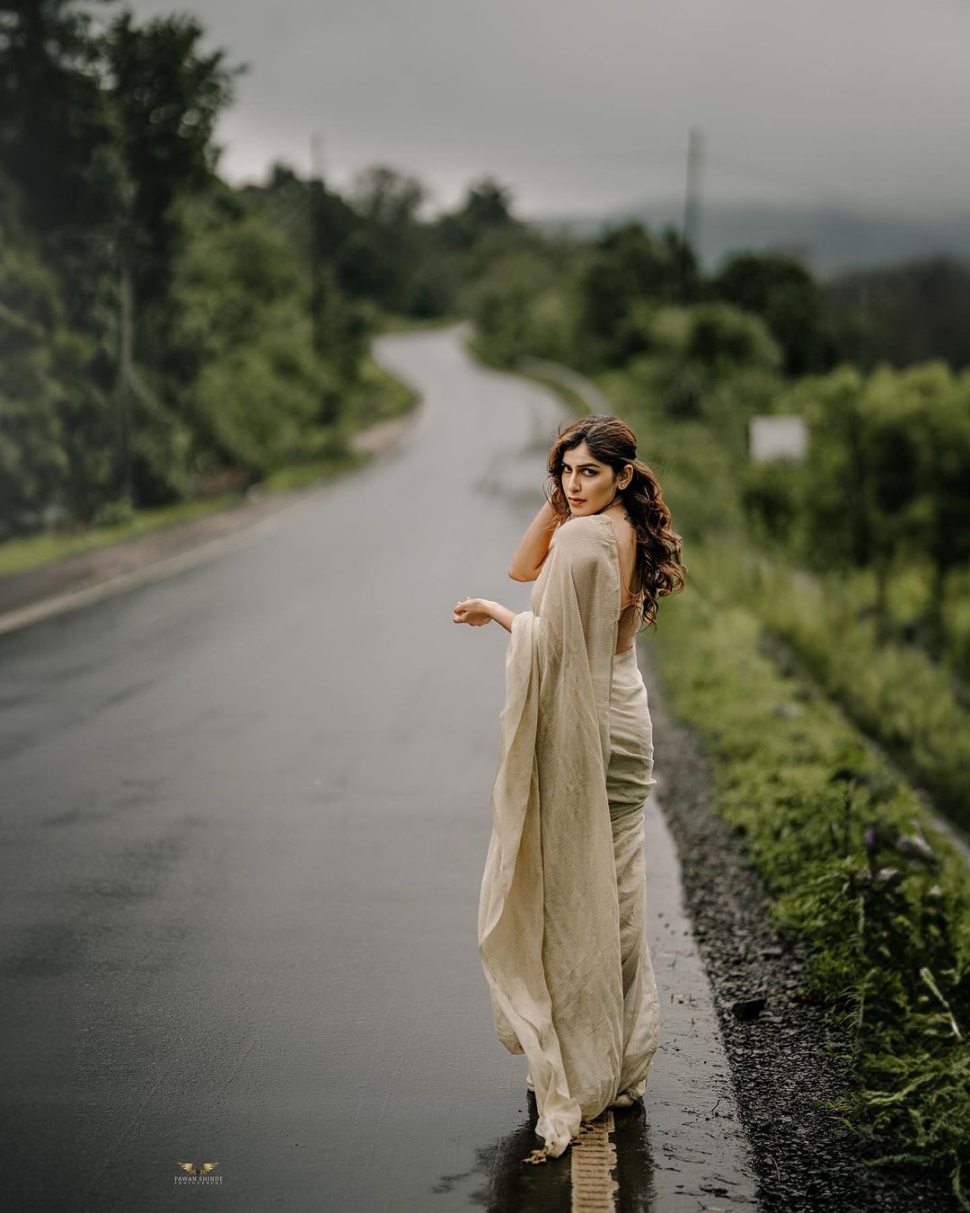 Indian girl In sari walking in the rain with umbrella, Pune, Maharashtra  Stock Photo by ©RealityImages 189011630