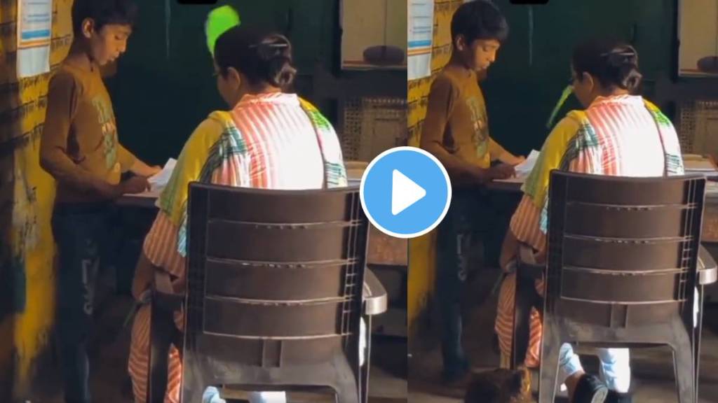 While studying a boy in a school the teacher was seen fanning him with a paper fan