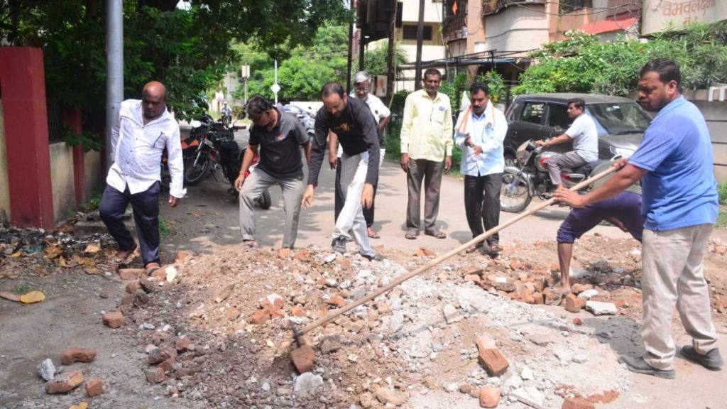 symbolic movement to fill the pothole