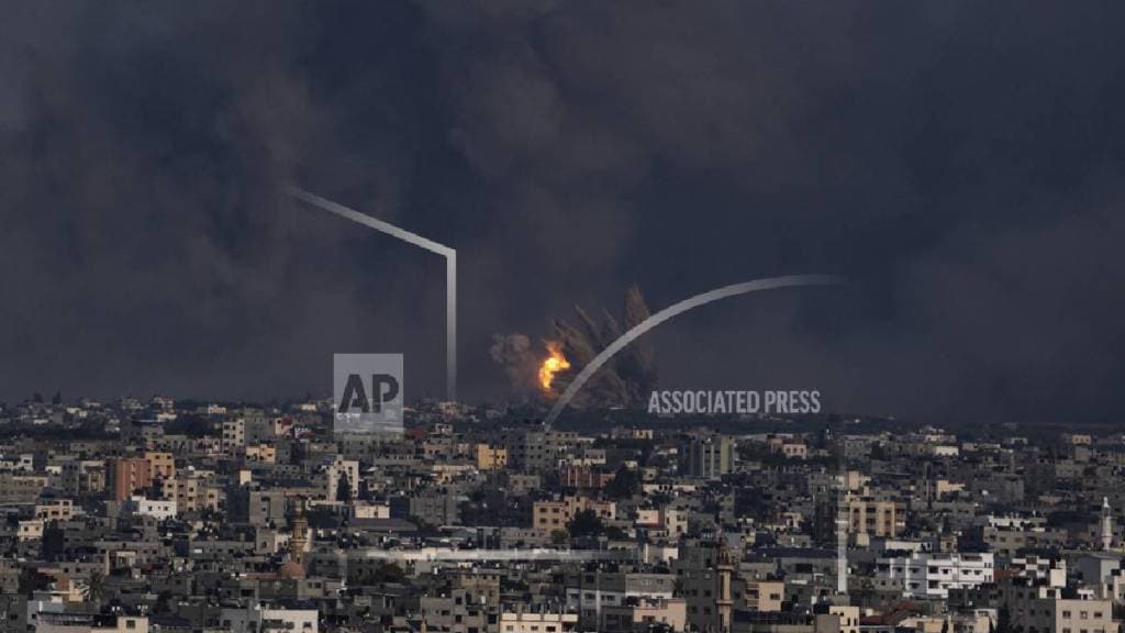 Fire and smoke rise following an Israeli airstrike, in Gaza City