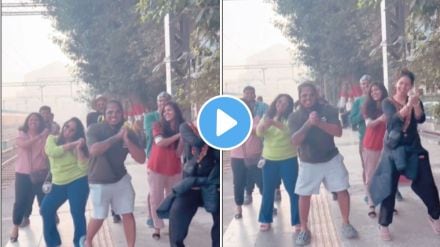 a group of friends dance on bollywood song on railway starion