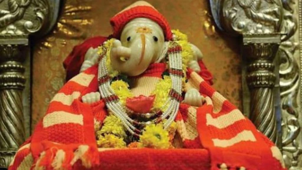 pune Sarasbaug Ganpati wearing sweater and cap in winter season