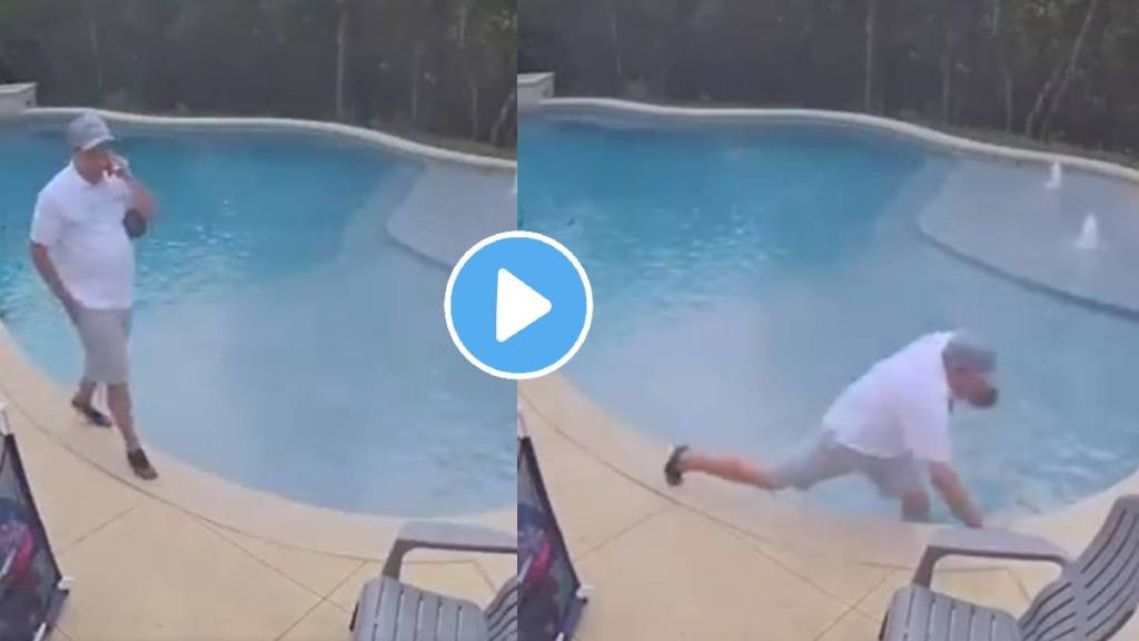 man kept talking on the phone despite falling in swimming pool video