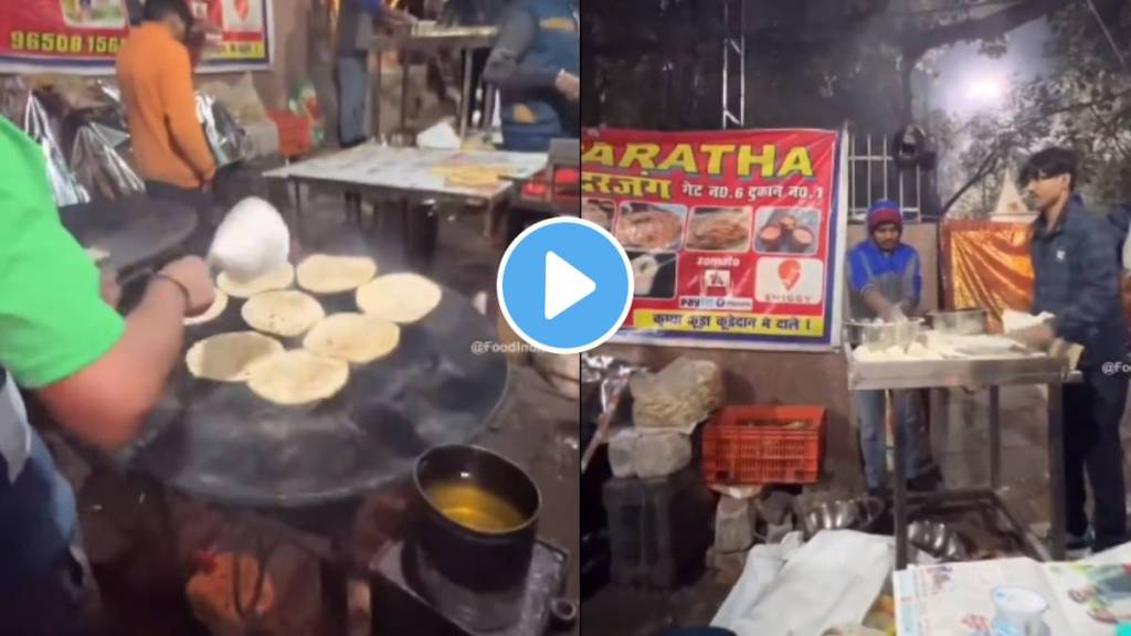 A street vendor incredible paratha dough tossing skills paratha dough hot pan located a few feet away