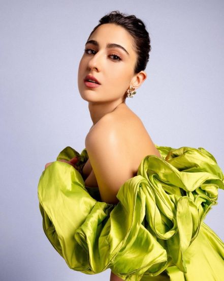 Sara ali khan flaunts in lime green off shoulder slit dress for Murder Mubarak promotions