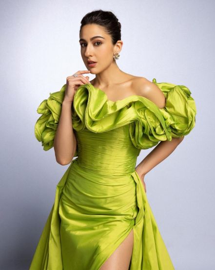 Sara ali khan flaunts in lime green off shoulder slit dress for Murder Mubarak promotions