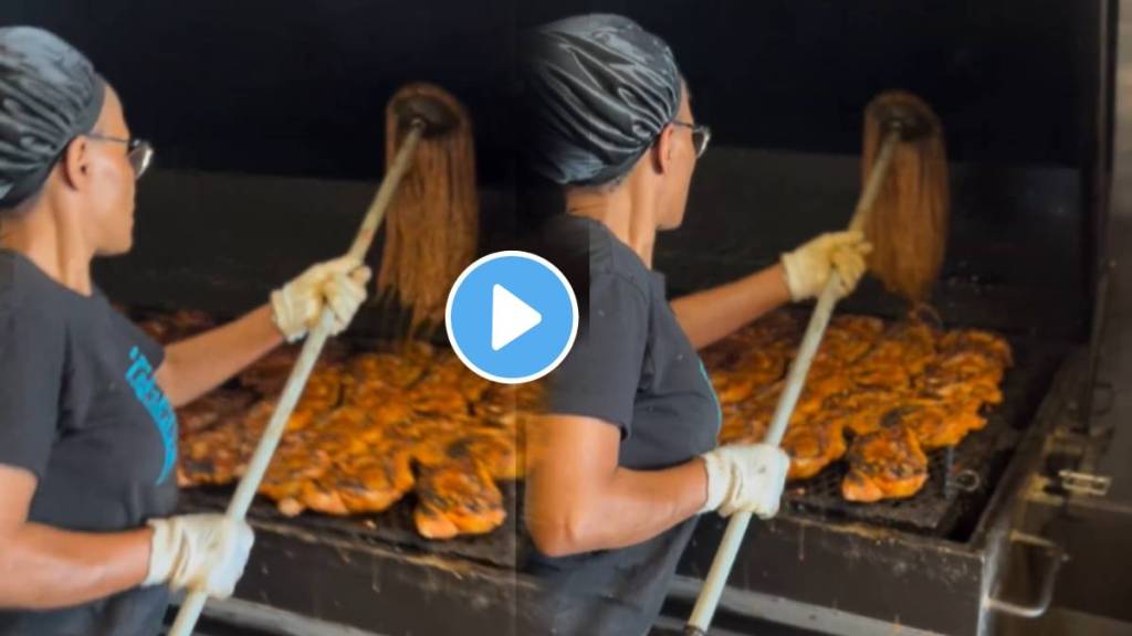 footage of a woman in kitchen dipping a mop into a sauce container and expertly basting meat on the grill watch video