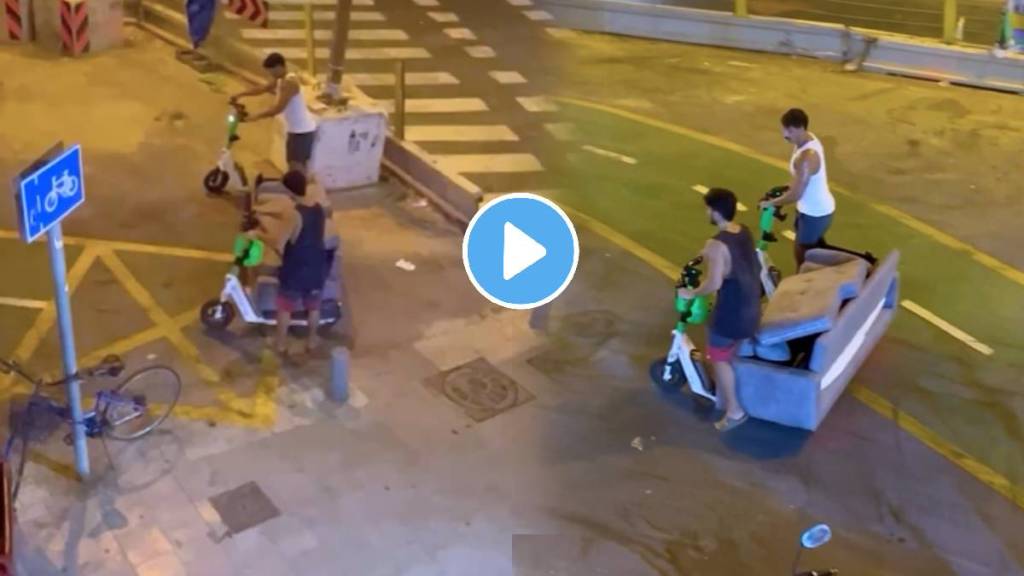 This Video Of Two Men carrying a hefty couch on their Electric scooters and casually riding off everyone said it Jugaad