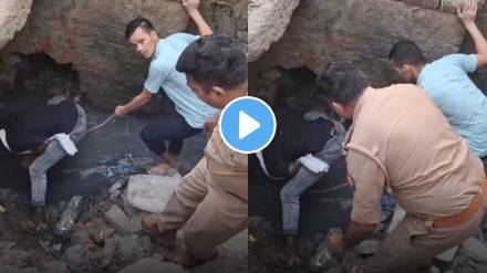 30 foot long fast flowing drainpipe drunk man trapped inside Police officers and few locals rescue a man watch viral video