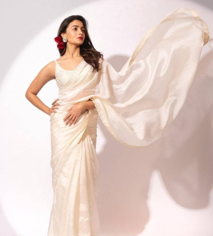 Alia Bhatt is another star known to promote her movies by making a fashion statement. For the promotion of her movie, Gangubai Kathiadwadi, she was seen in a variety of white sarees. In the movie, Alia as Gangubai plays the role of a powerful prostitute who is known to wear only white sarees. In this look, the red roses bring together the look even more, as her character wears them during celebrations in the movie. (Photo: Instagram/@aliaabhatt)